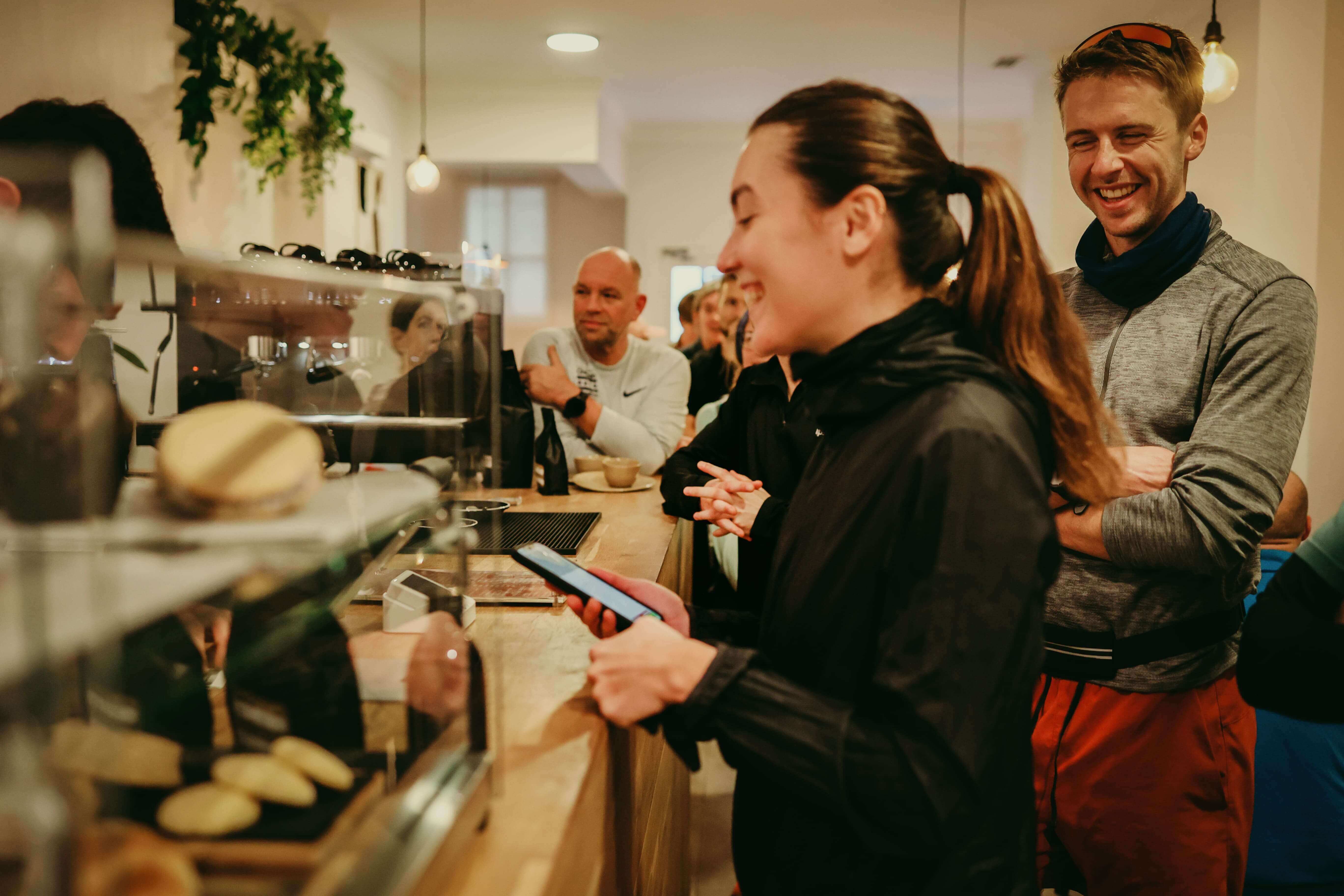 Female runner ordering coffee